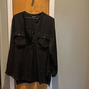 Black long sleeve blouse by Robert Rodriguez.